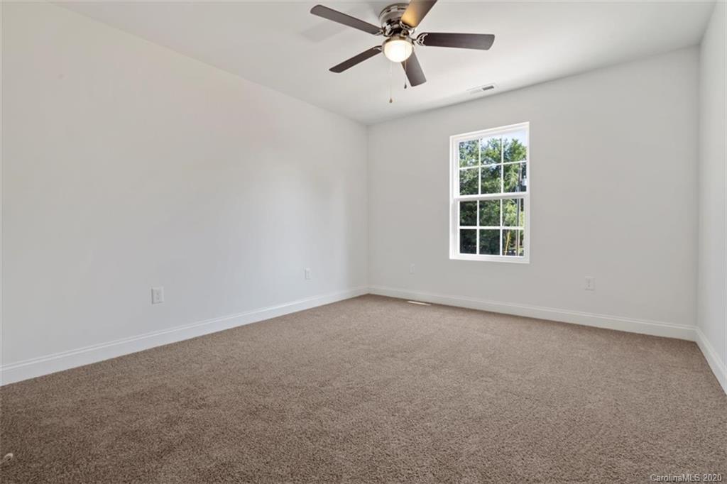 2979 Greenleaf Road, Unit 5 Clover, SC 29710 - Photo 33 of 46 an empty room with a window and a fan
