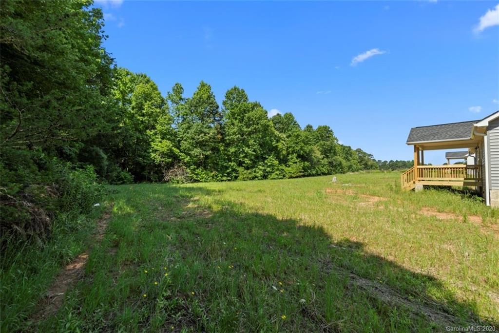 2979 Greenleaf Road, Unit 5 Clover, SC 29710 - Photo 39 of 46 a view of a lake with a yard