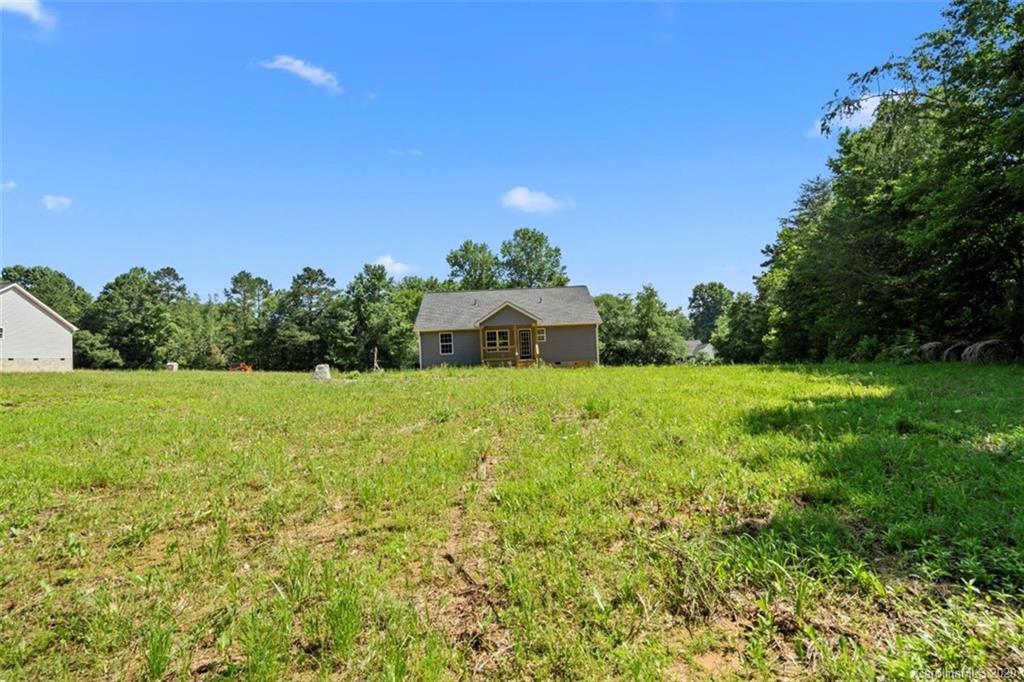 2979 Greenleaf Road, Unit 5 Clover, SC 29710 - Photo 42 of 46 a front view of a house with yard and green space