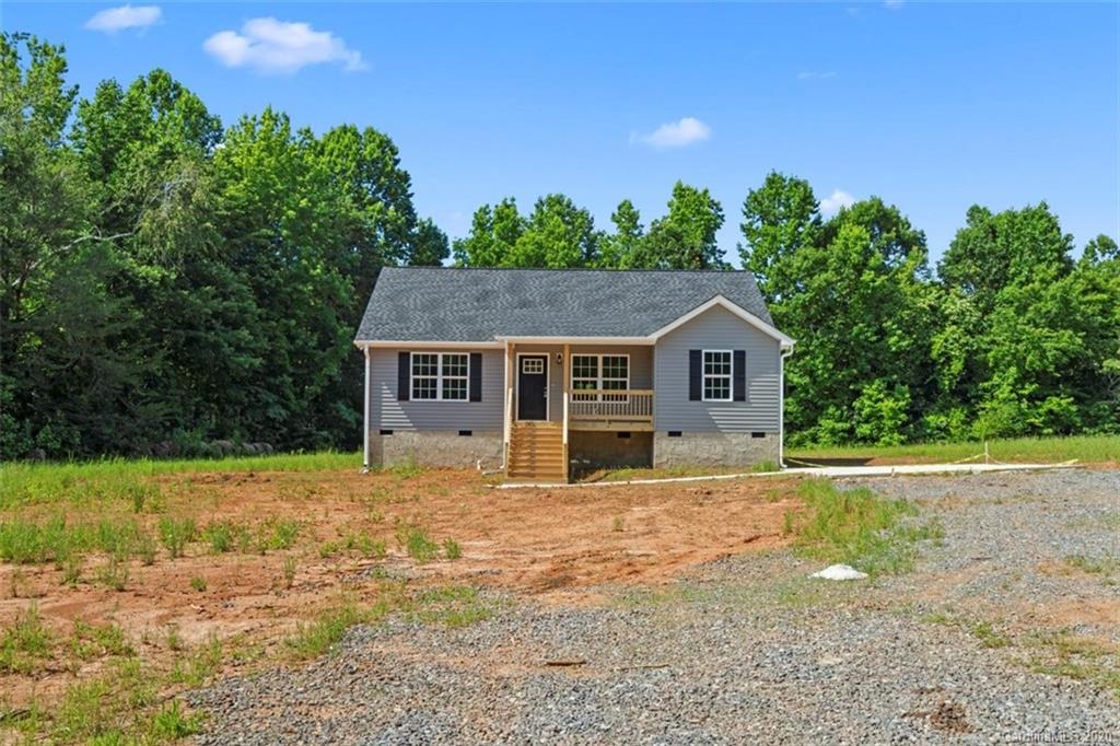 2979 Greenleaf Road, Unit 5 Clover, SC 29710 - Photo 43 of 46 a house with trees in the background