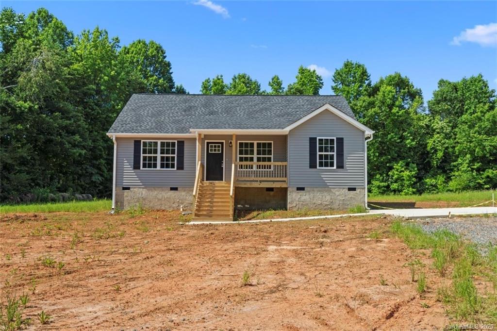 2979 Greenleaf Road, Unit 5 Clover, SC 29710 - Photo 44 of 46 a house with trees in the background