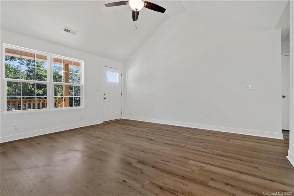 2979 Greenleaf Road, Unit 5 Clover, SC 29710 - Photo 8 of 46 wooden floor in an empty room with a window