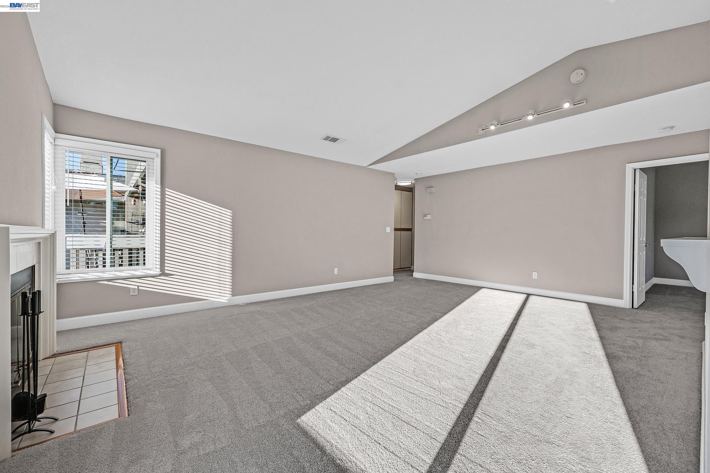 3769 Crow Canyon Road San Ramon, CA 94582 - Photo 7 of 56 a view of an empty room with wooden floor and a window