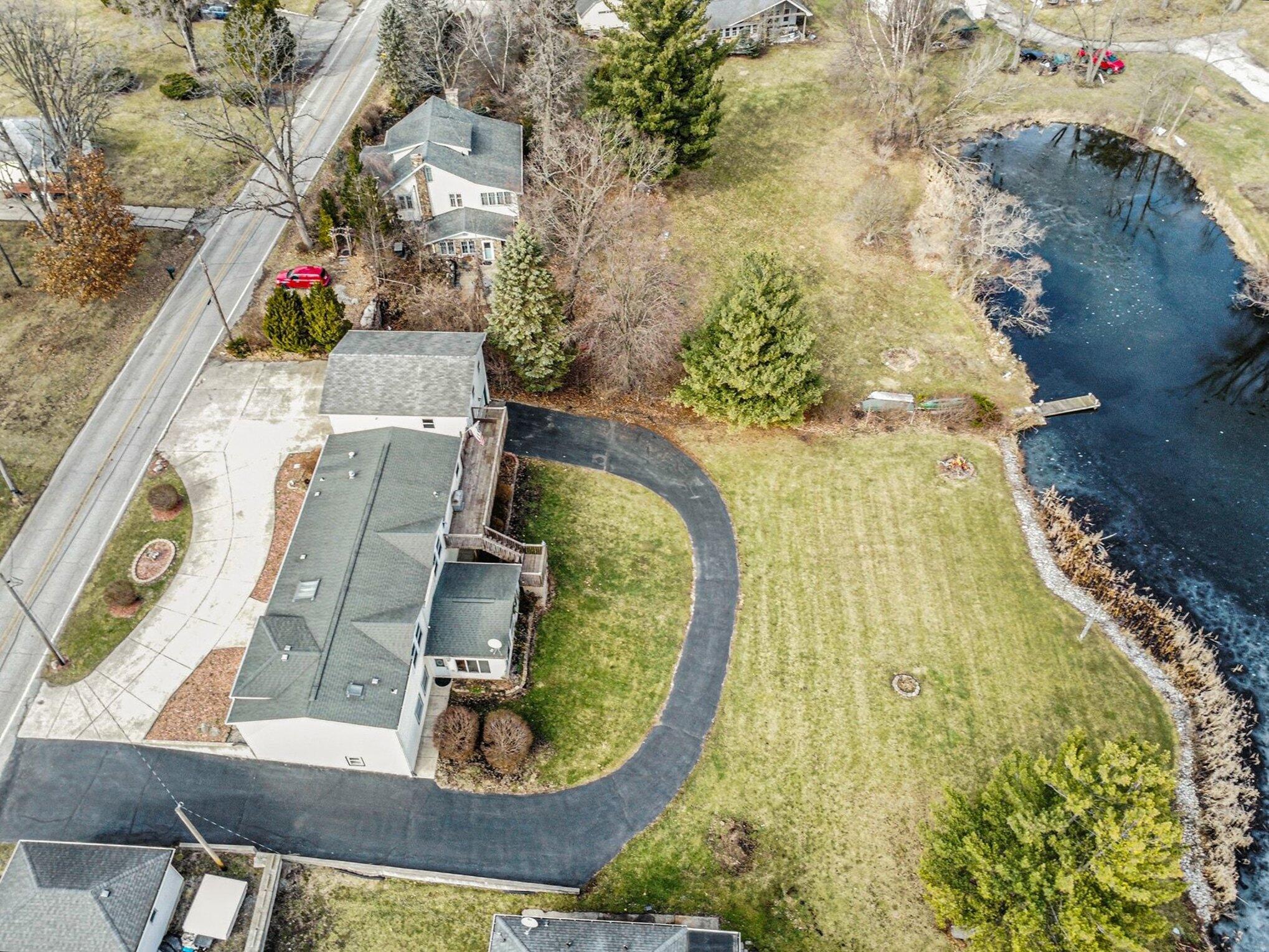 33 South 600 West Hebron, IN 46341 - Photo 8 of 36 an aerial view of a house with a swimming pool