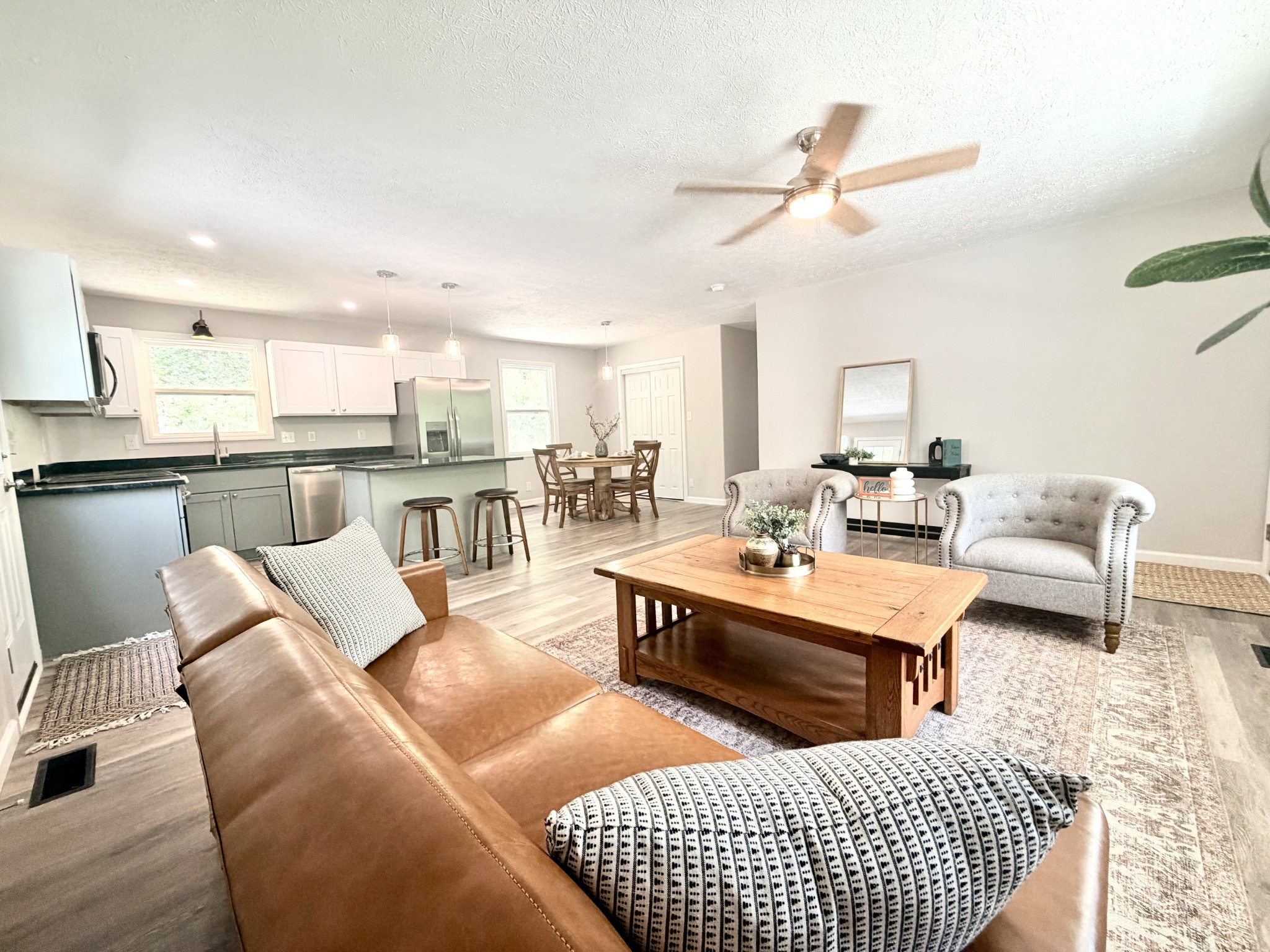 5075 Logan Road Cunningham, TN 37052 - Photo 9 of 22 a living room with furniture kitchen view and a table