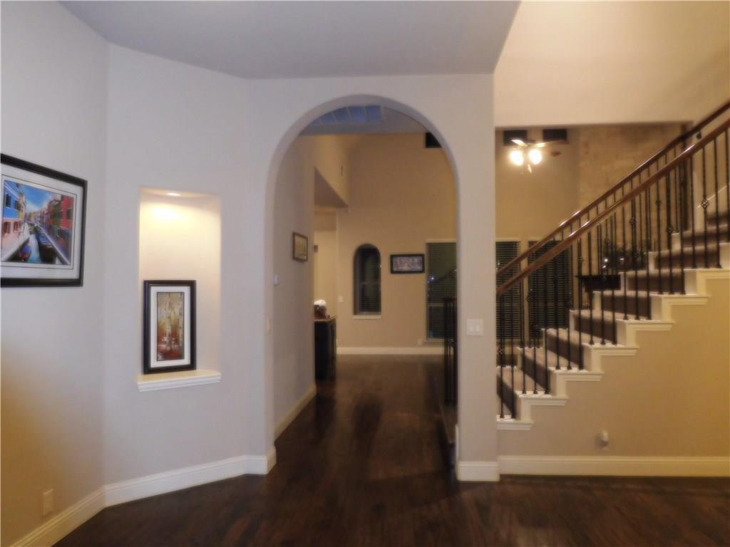 961 Crystal Falls Drive Prosper, TX 75078 - Photo 12 of 33 a view of entryway and hall with wooden floor