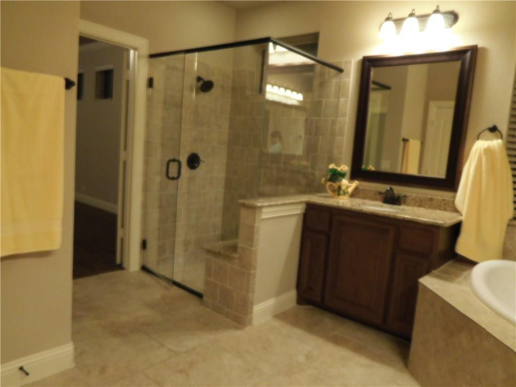 961 Crystal Falls Drive Prosper, TX 75078 - Photo 24 of 33 a bathroom with a sink and a mirror