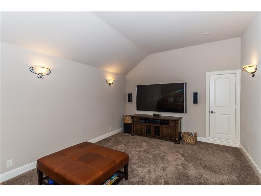 961 Crystal Falls Drive Prosper, TX 75078 - Photo 25 of 33 a living room with furniture and a flat screen tv