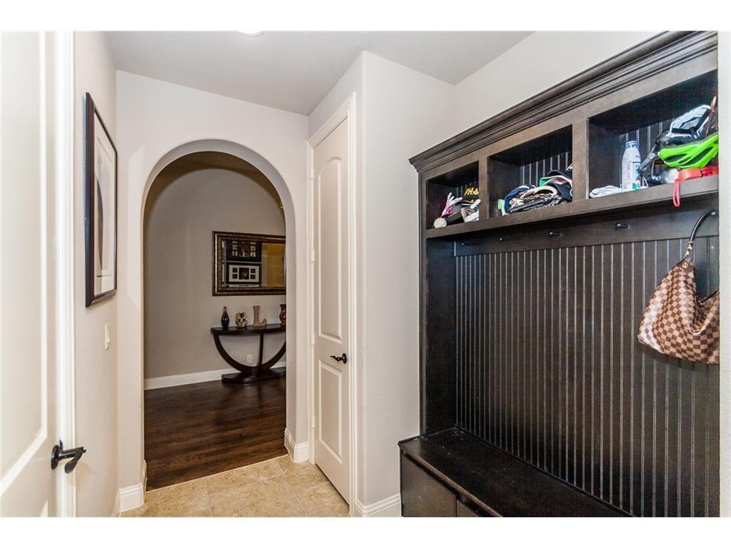 961 Crystal Falls Drive Prosper, TX 75078 - Photo 28 of 33 a view of a entryway door of the house and living room