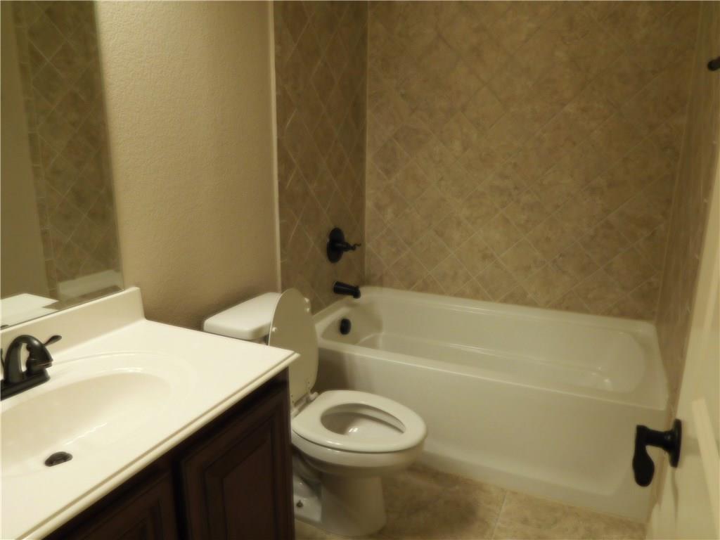 961 Crystal Falls Drive Prosper, TX 75078 - Photo 29 of 33 a bathroom with a sink and a bathtub