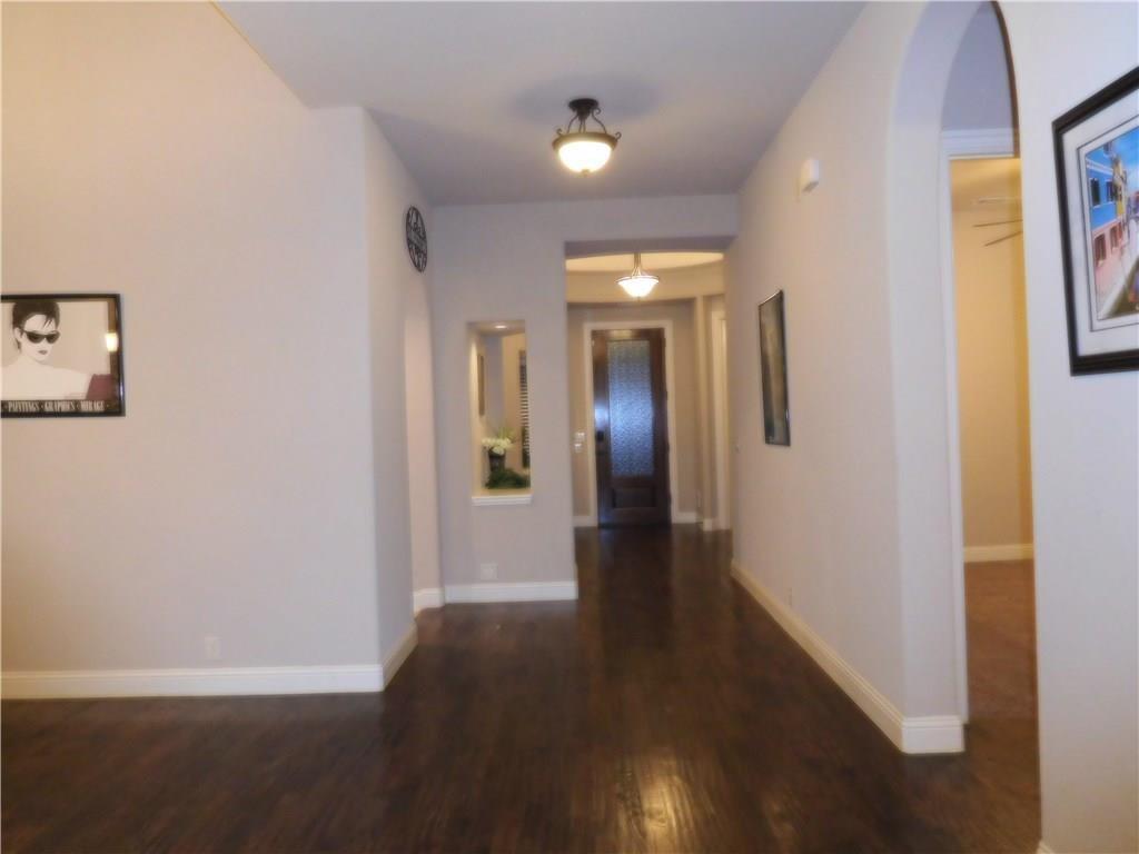 961 Crystal Falls Drive Prosper, TX 75078 - Photo 3 of 33 a view of a hallway with wooden floor