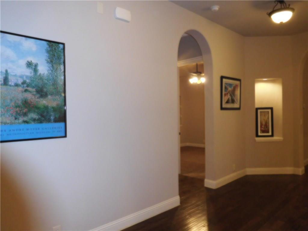 961 Crystal Falls Drive Prosper, TX 75078 - Photo 6 of 33 a view of a hallway with wooden floor