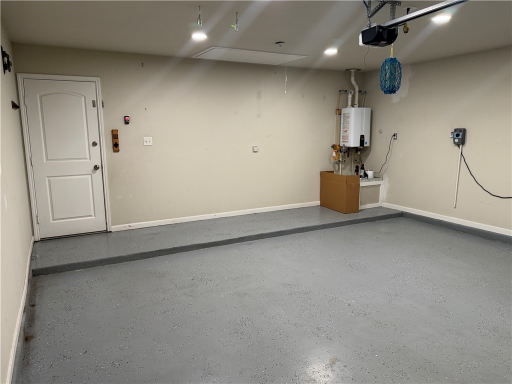 2071 Positano Loop Bryan, TX 77808 - Photo 26 of 29 Garage. Tankless hotwater heater