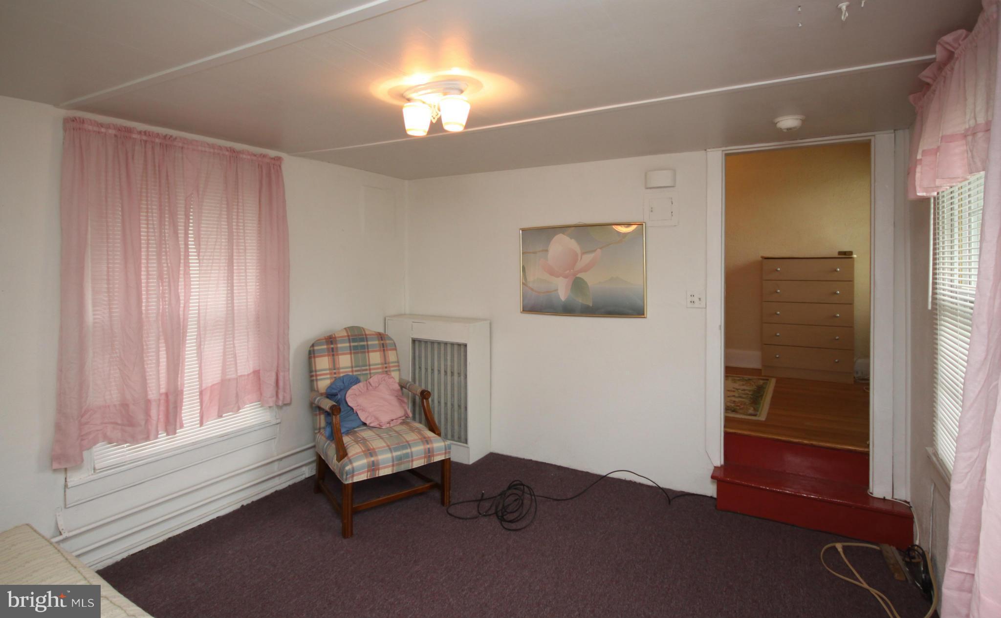1610 South Rolling Road Baltimore, MD 21227 - Photo 15 of 19 a living room with furniture and a window