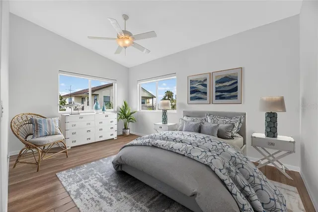 a bedroom with a bed and a chair