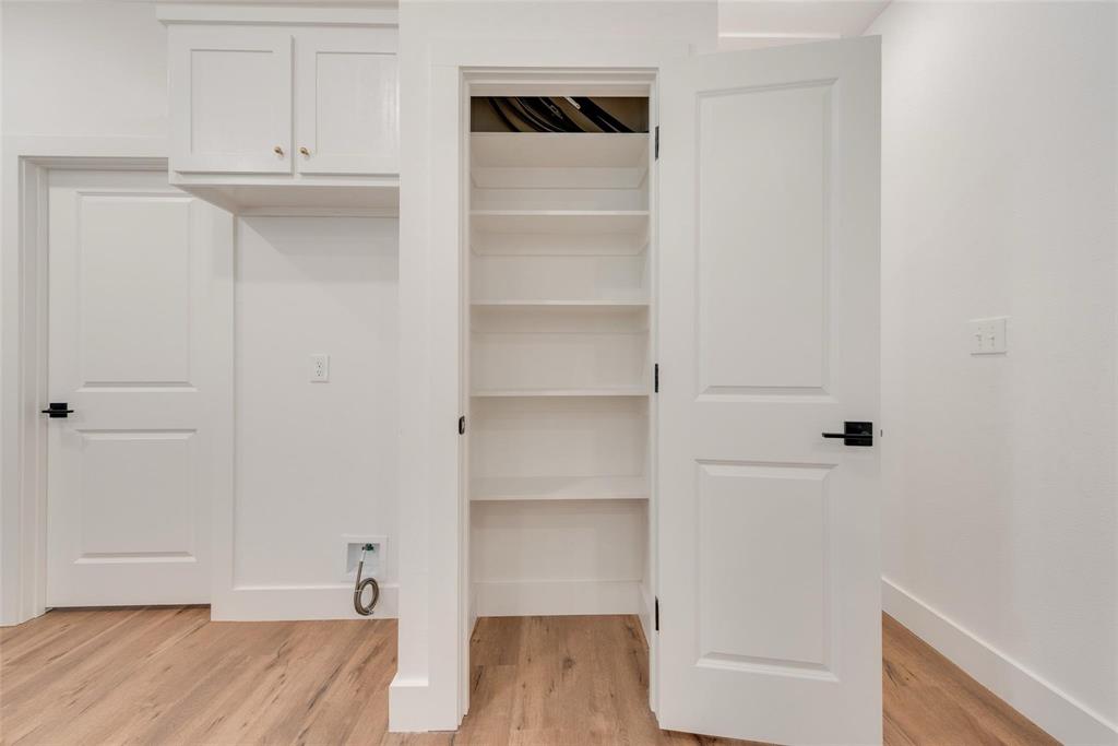 1807 Franklin Street Bonham, TX 75418 - Photo 12 of 13 a view of walk in closet with empty racks