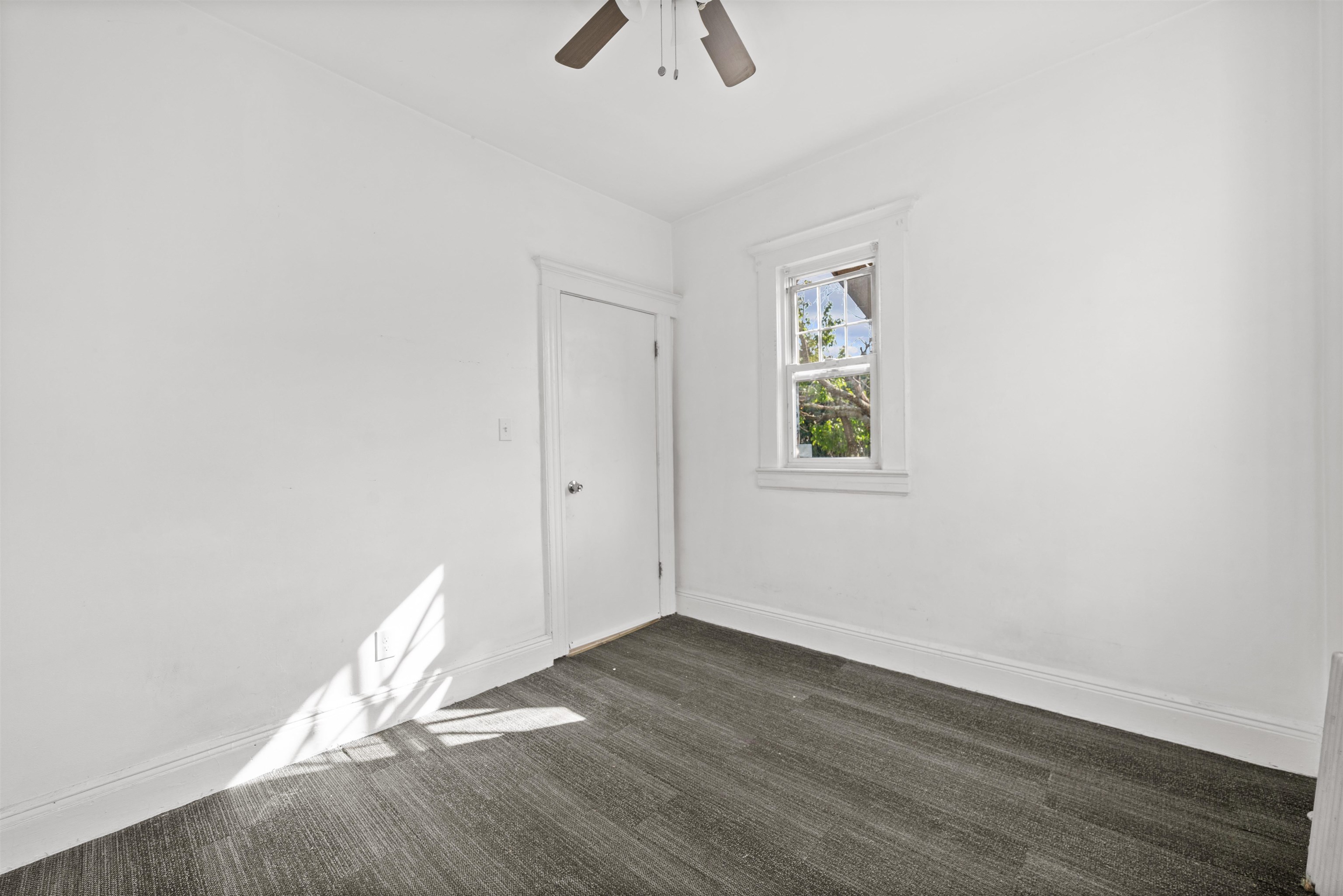 21 Walnut Street, Unit 2 Clifton, NJ 07013 - Photo 10 of 14 an empty room with wooden floor closet and windows