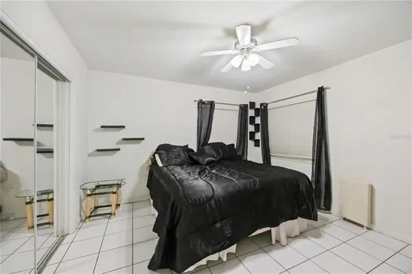 a bedroom with a bed and a walk in closet