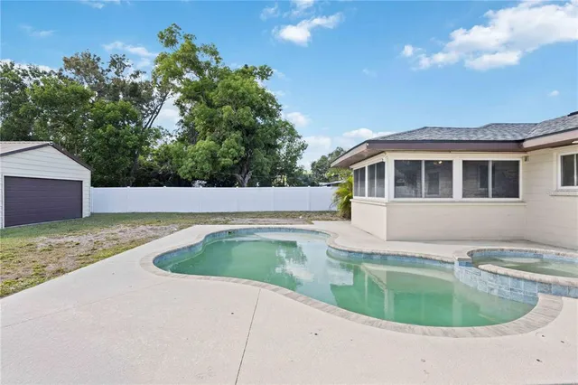 a view of house with outdoor space and sitting area