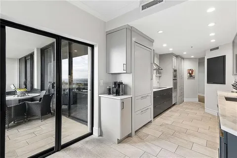 a bathroom with a granite countertop sink mirror and toilet