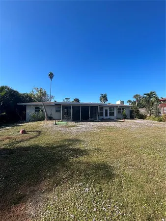a view of a big yard with a house