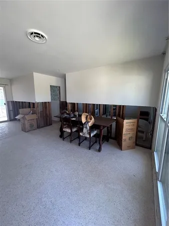 a view of a livingroom with furniture and window