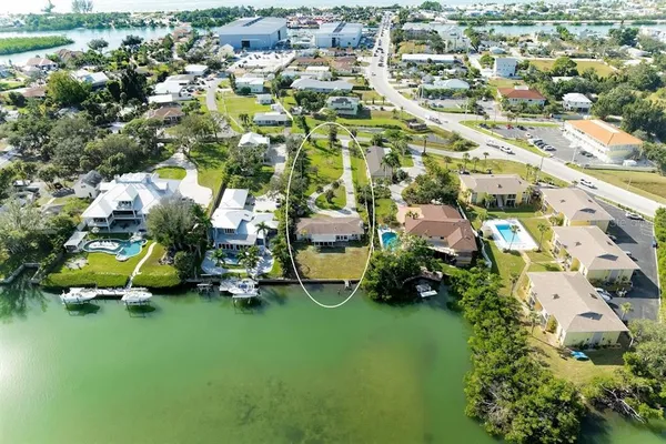 an aerial view of multiple houses with yard