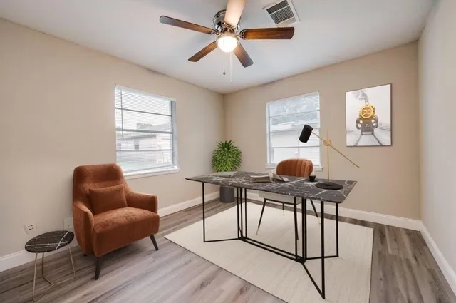 a work room with furniture and windows