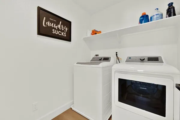 a utility room with dryer and washer