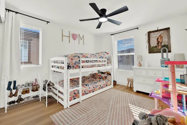 a bed room with a bed and a baby bed