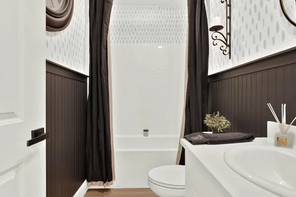 a bathroom with a toilet a sink and bathtub