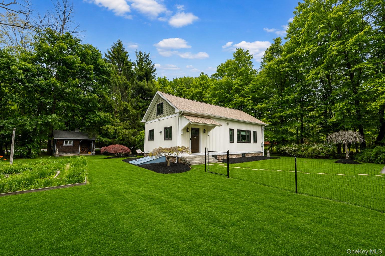 4 Clove Branch Road Hopewell Junction, NY 12533 - Photo 3 of 32 a view of a house with a yard and sitting area