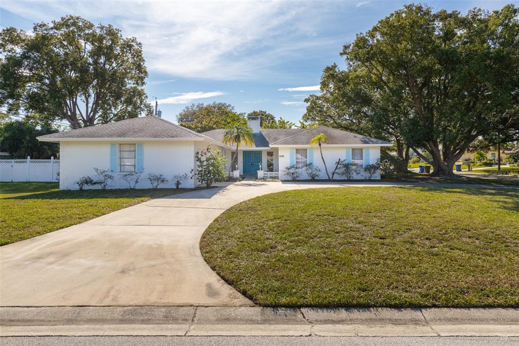 Welcome to 1455 Fairway Drive!   A circle driveway allows plenty of off street parking and convenient access to the side entry 2 car garage!