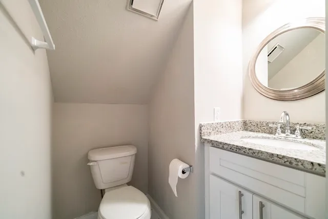 a bathroom with a toilet and a sink