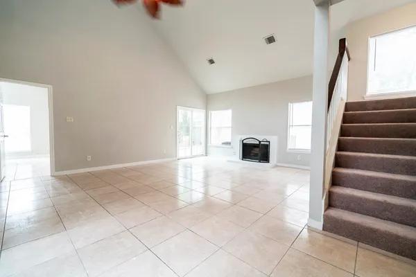 a view of an entryway with wooden floor