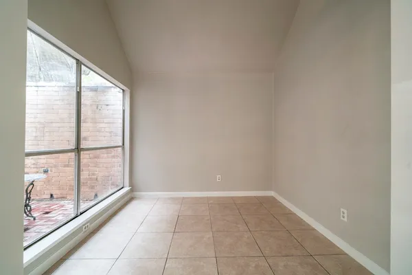 a view of an empty room and window