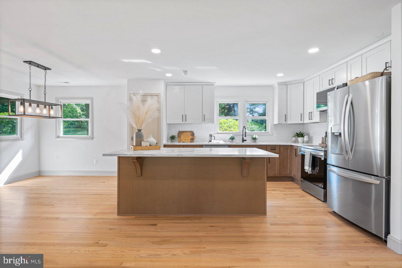 4702 Parkvale Road Ellicott City, MD 21043 - Photo 6 of 39 Kitchen Area with Breakfast Bar