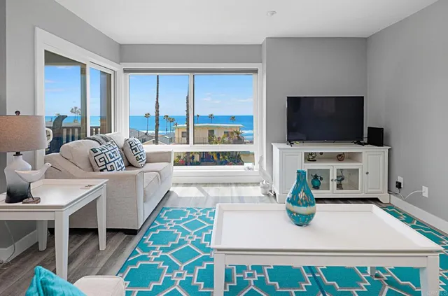 a living room with a toilet and a wooden floor