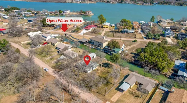 an aerial view of a houses with ocean view