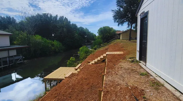 a view of a backyard with sitting area