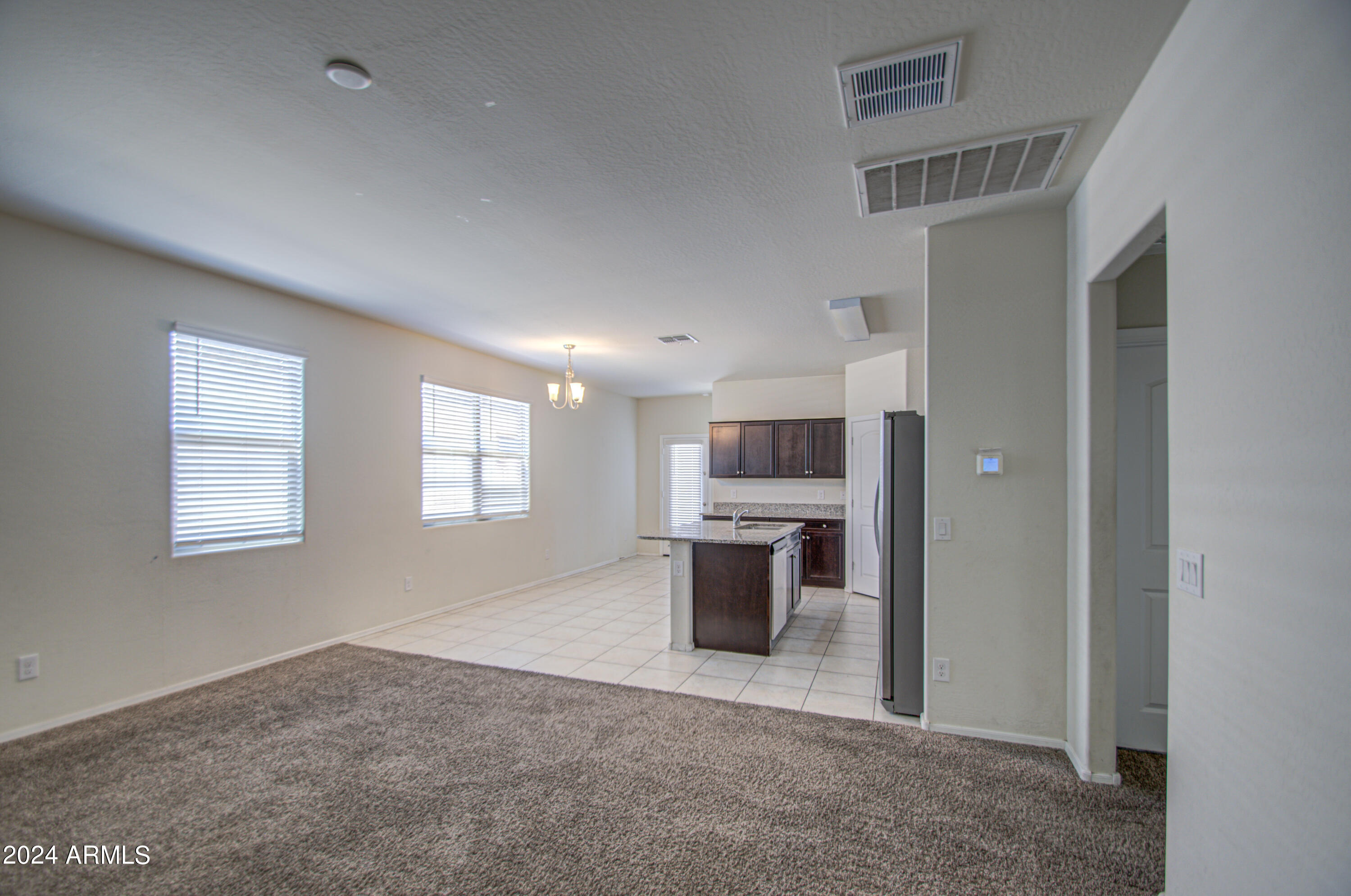 30992 West Picadilly Road Buckeye, AZ 85396 - Photo 6 of 29 Living Room 1