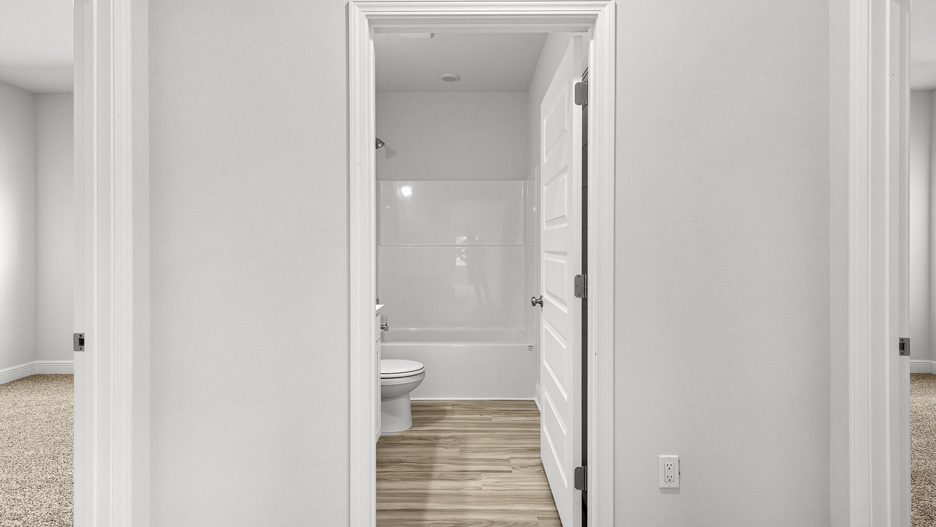 8682 Bluebell Street Milton, FL 32583 - Photo 21 of 28 a bathroom with a granite countertop toilet and a shower