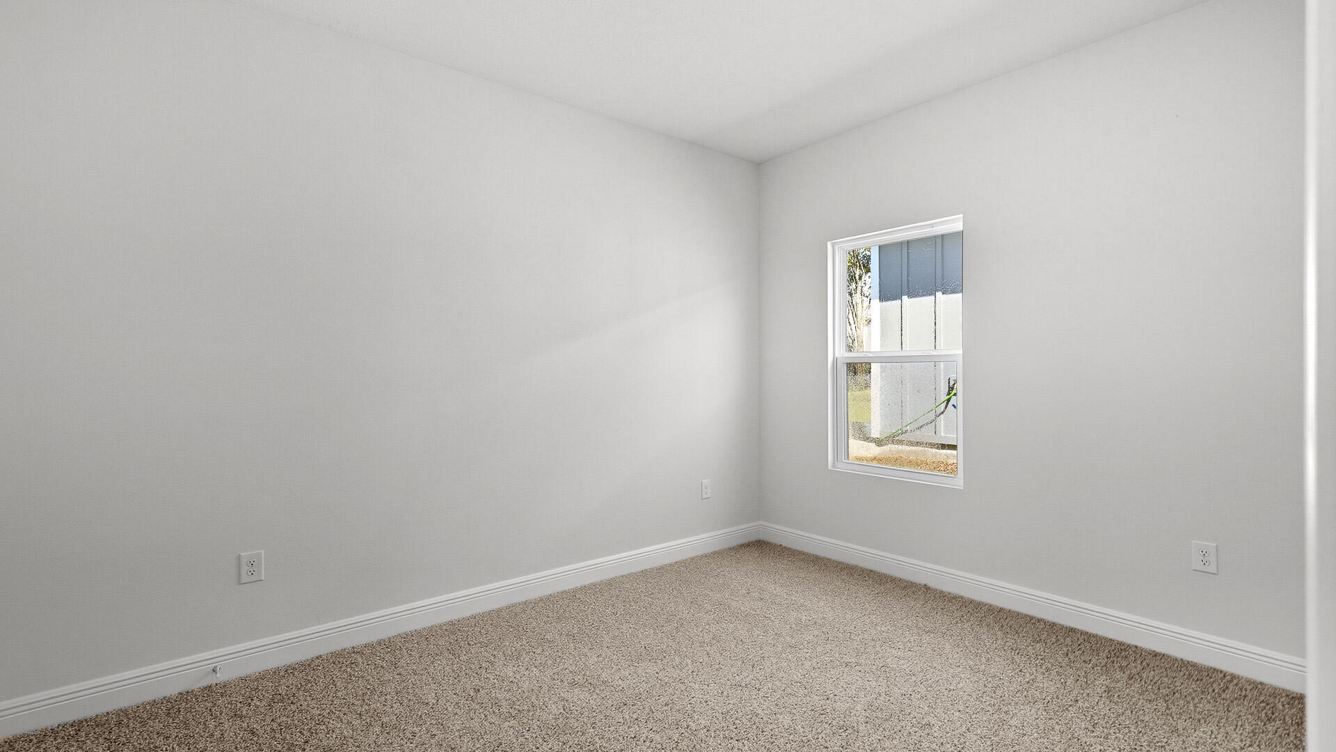 8682 Bluebell Street Milton, FL 32583 - Photo 26 of 28 an empty room with a window