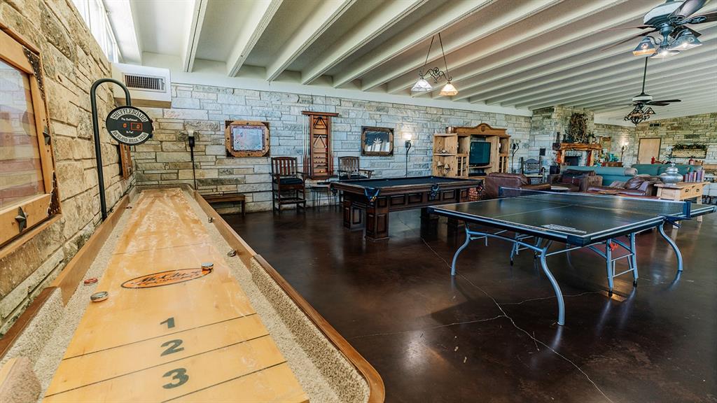 175 Tobacco Road Whitney, TX 76692 - Photo 16 of 35 Recreation room featuring beam ceiling, a ceiling fan, and billiards table