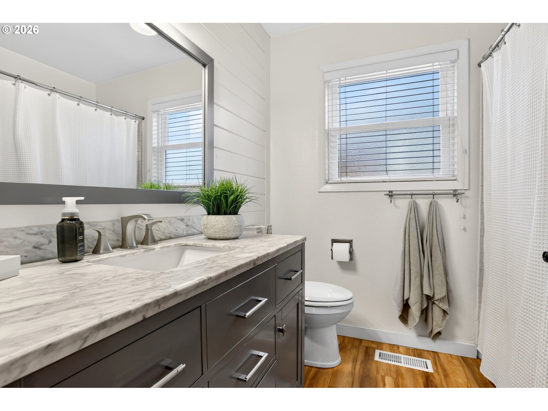 1776 Southeast 114th Place Portland, OR 97216 - Photo 35 of 47 a bathroom with a granite countertop sink and a toilet
