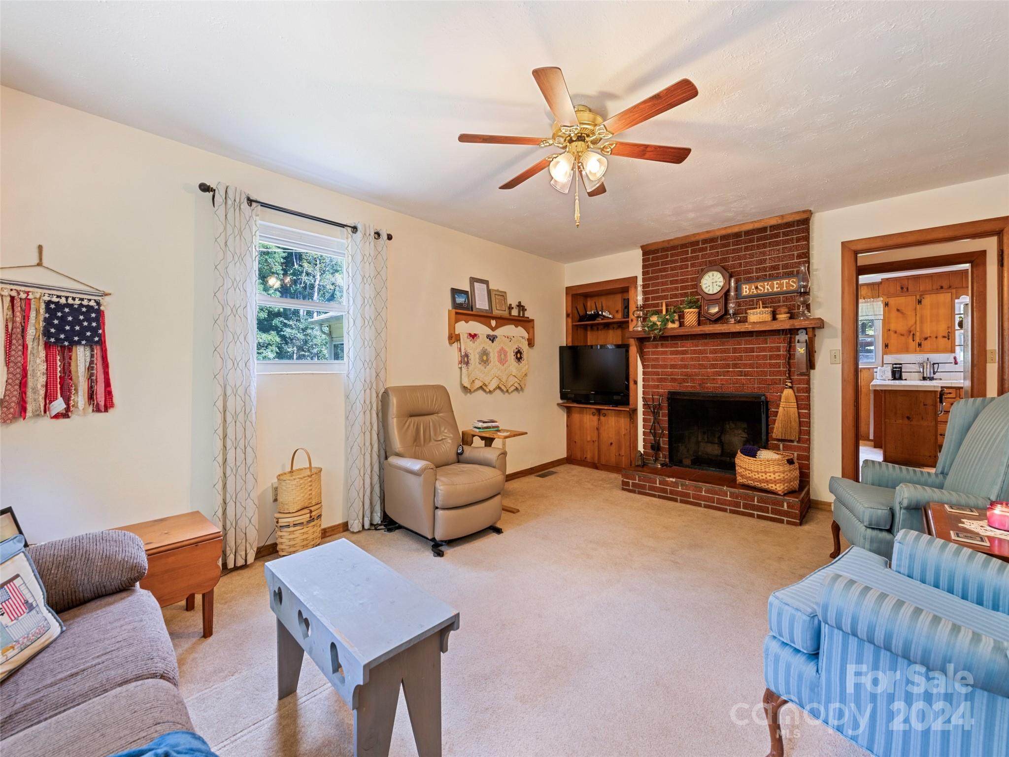 262 Bunny Run Road Canton, NC 28716 - Photo 24 of 45 a living room with furniture and a fireplace