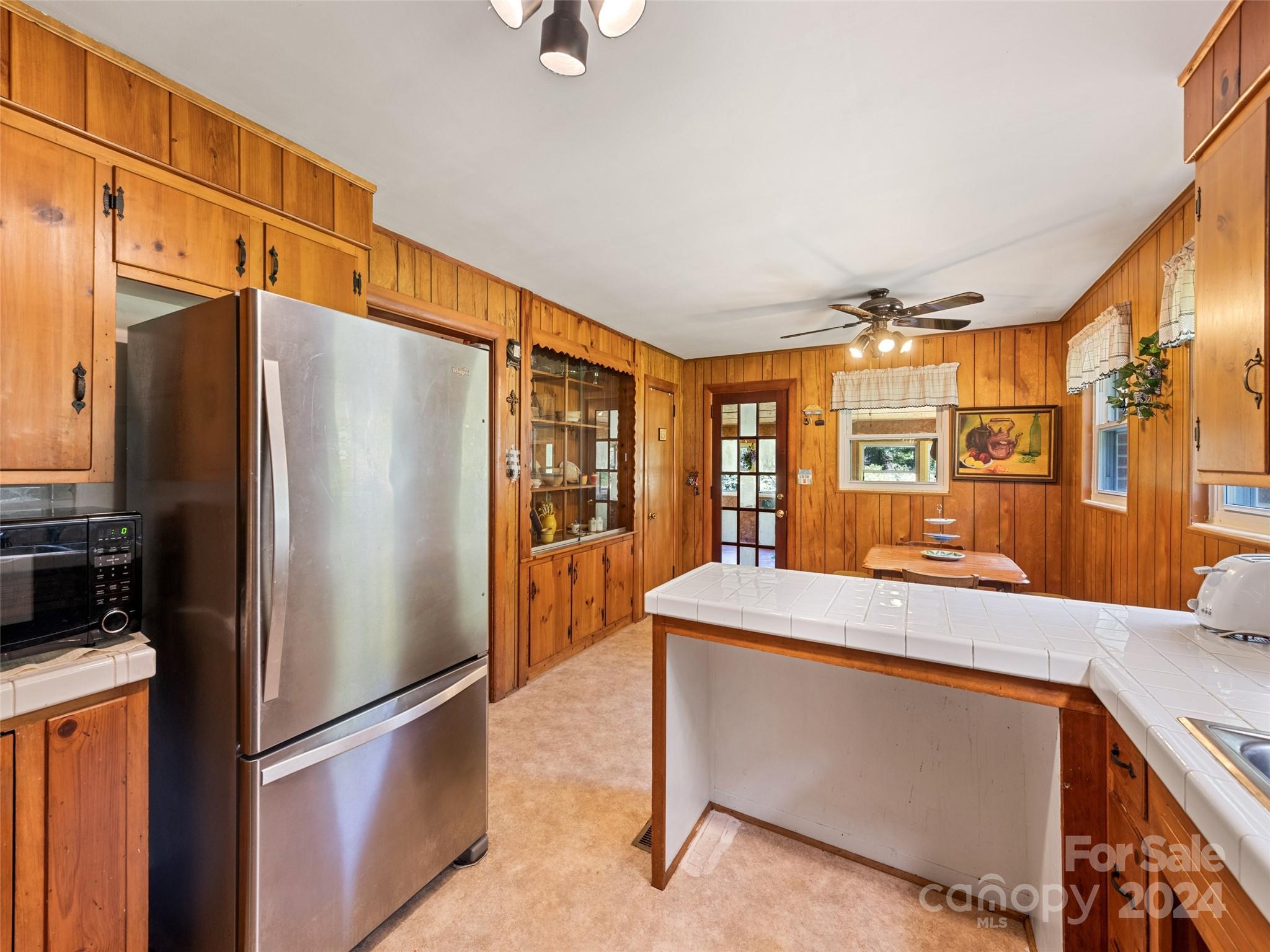 262 Bunny Run Road Canton, NC 28716 - Photo 29 of 45 a kitchen with stainless steel appliances granite countertop a refrigerator and a stove