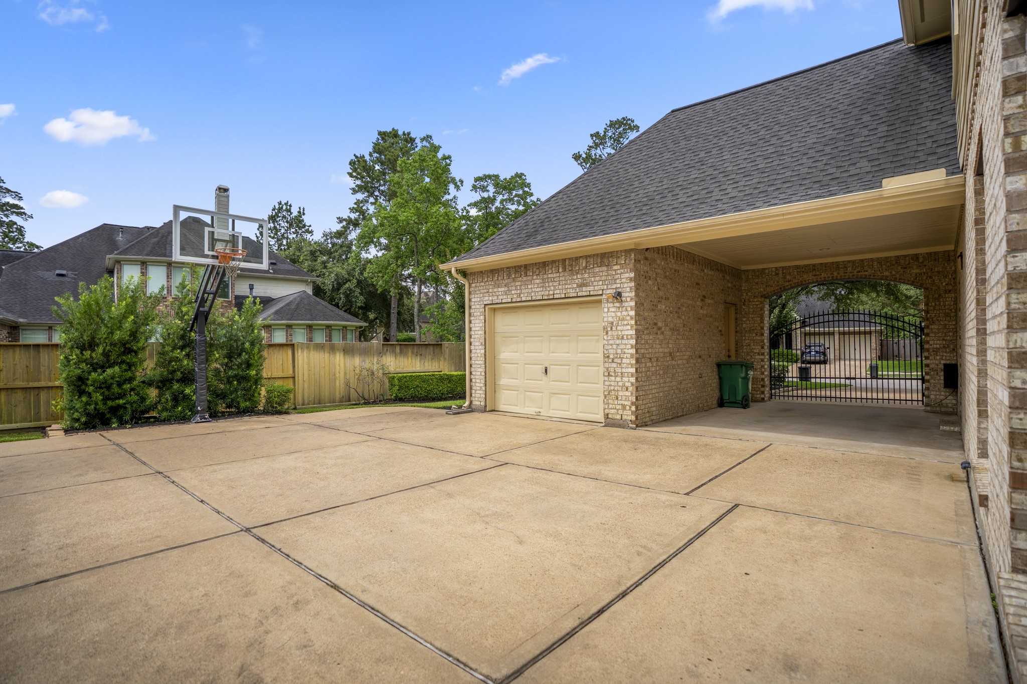 1438 Hatchmere Place Spring, TX 77379 - Photo 38 of 50 Tucked securely with private driveway gate & porte-cochère you have space with the 4-car garage.