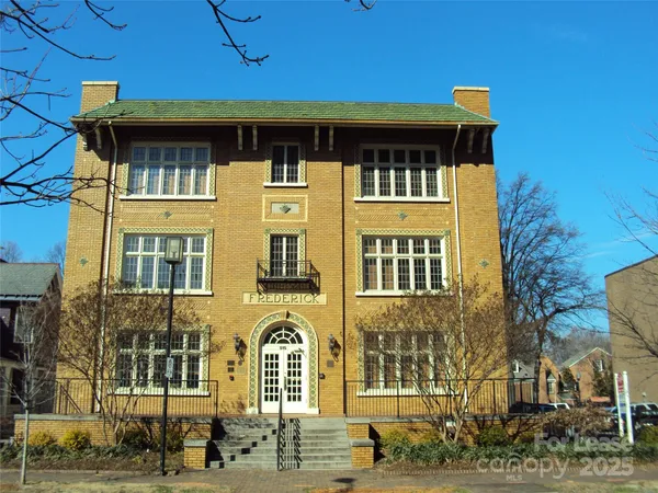 a front view of a building with a street