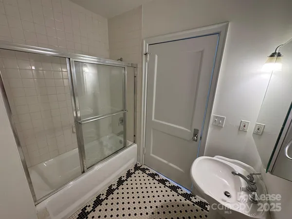 a bathroom with a sink mirror vanity and toilet
